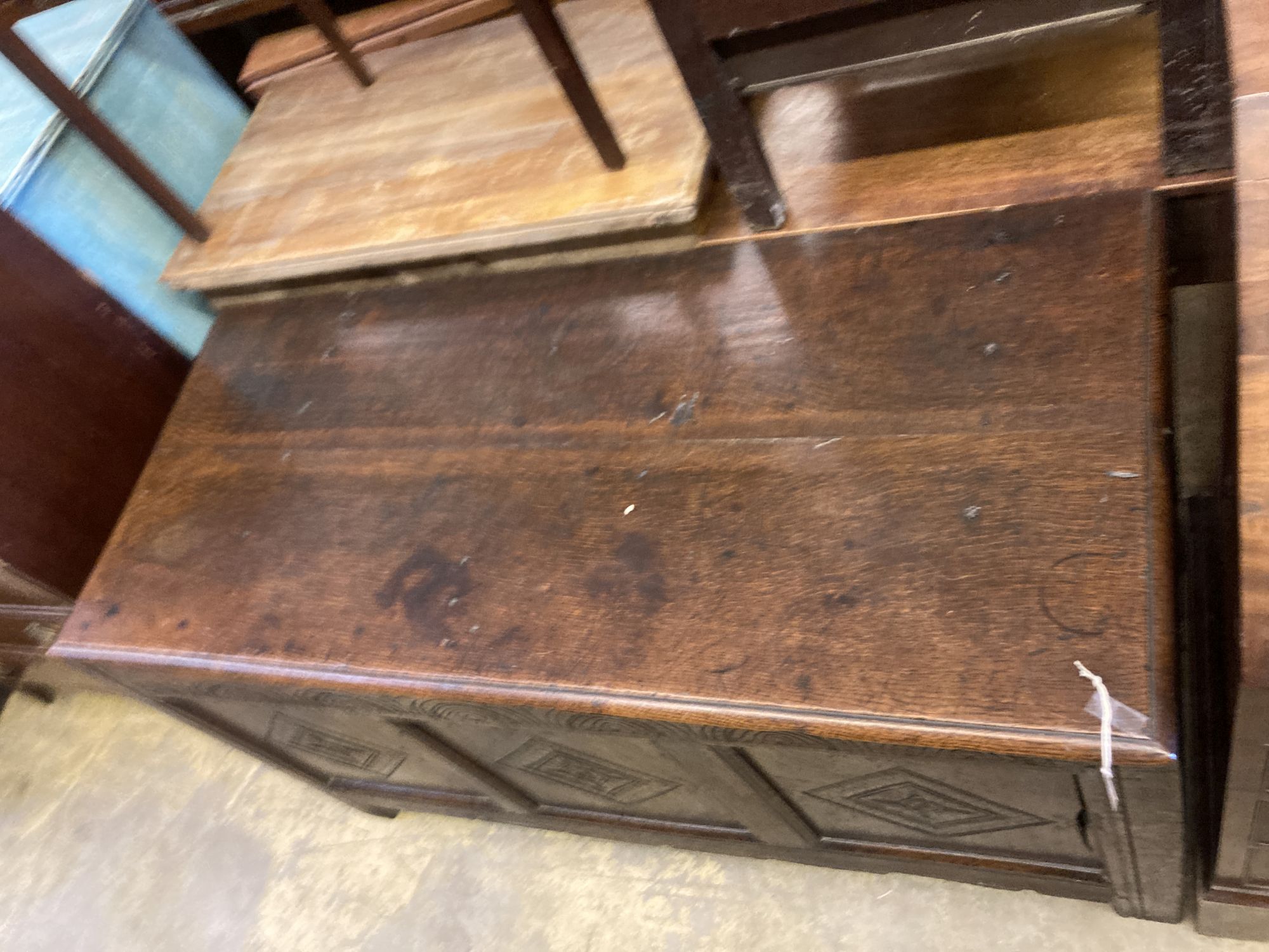 An 18th century carved oak coffer, length 134cm, depth 60cm, height 72cm